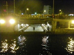 The retracted bridge is above the guy's head